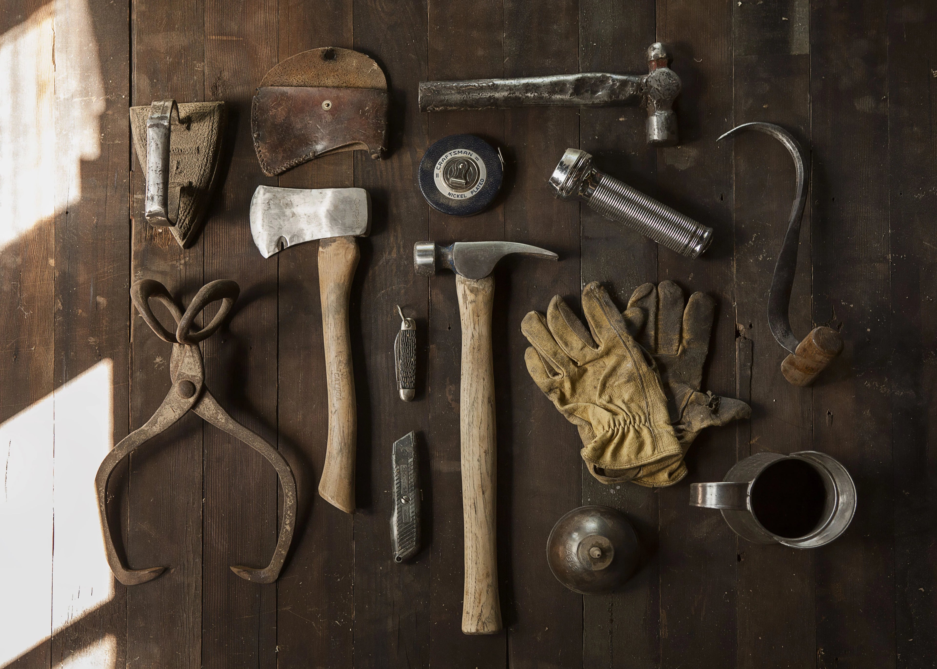 Collection of vintage tools on a wooden surface
